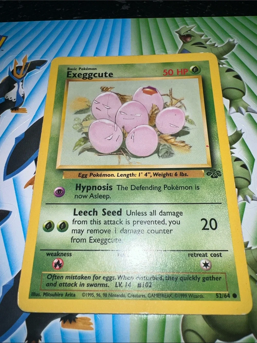 Pokemon Exeggcute Card — Pink Eggs with Yellow Border and Green Card Face